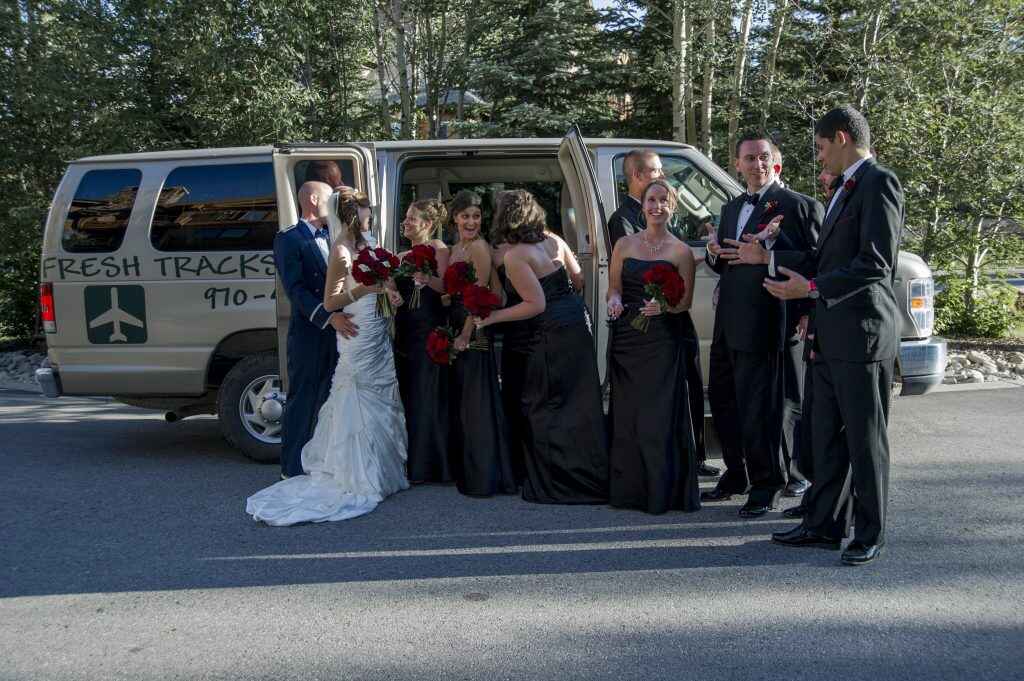 couple with friends outside fresh tracks shuttle